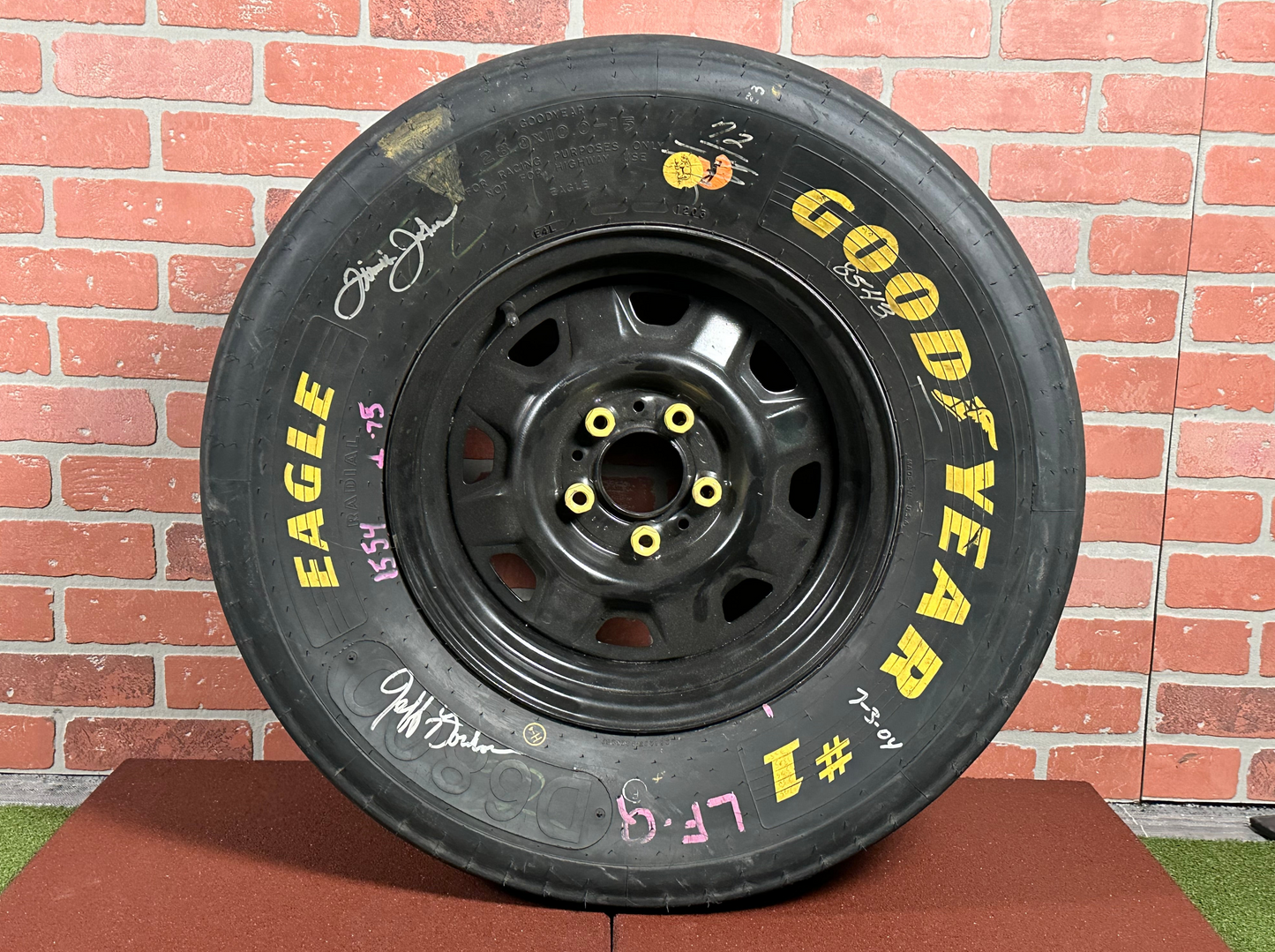 NASCAR Tire autographed by Jimmy Johnson and Jeff Gordon